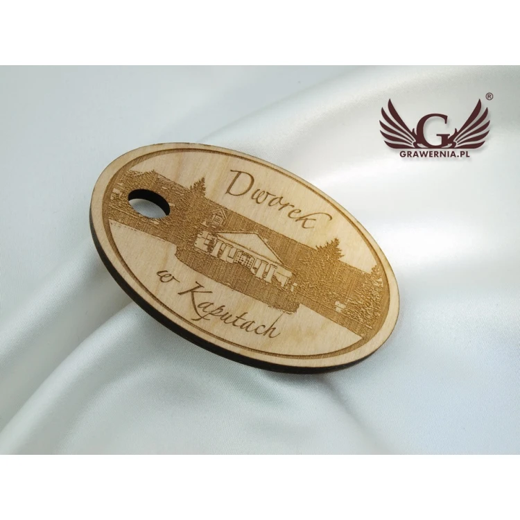 Brelok drewniany Owal 2 - kolor naturalny - wym. 80x50mm - BD085